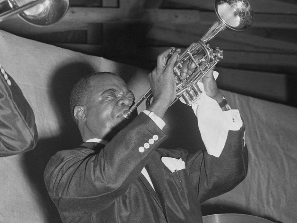 Louis Armstrong Performing With Other Musicians